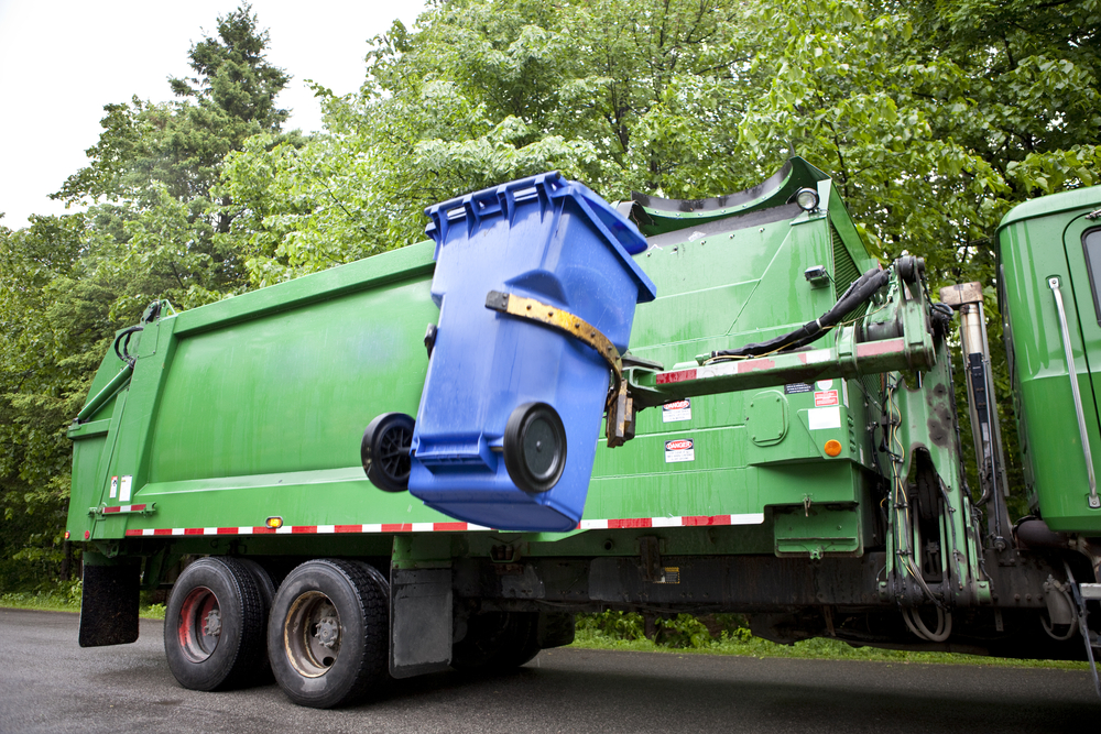 garbage truck picks up trash