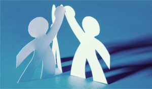 Paper cutout people high-fiving. Partnership concept.
