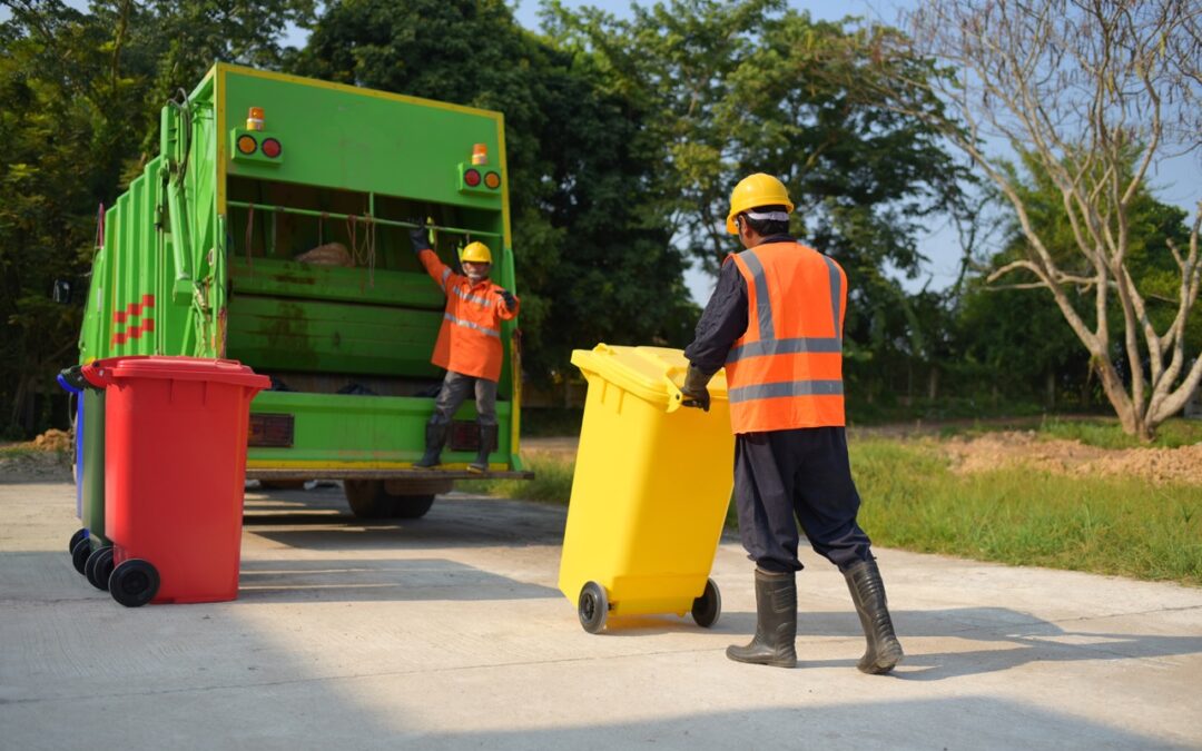 trash collectors loading truck