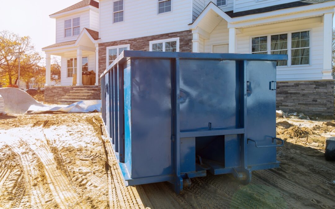 construction dumpster in front of new house