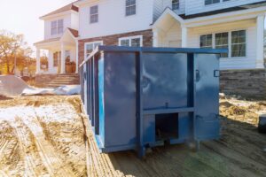 construction dumpster in front of new house