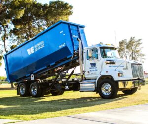 western elite roll of dumpster being dropped off
