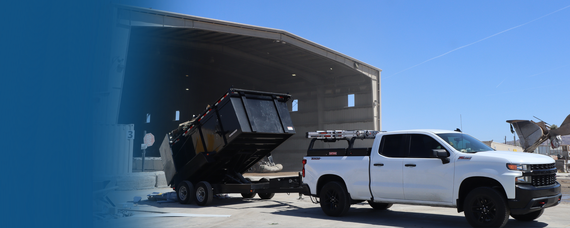 Western Elite dump trailer being towed by a service truck at the Las Vegas facility